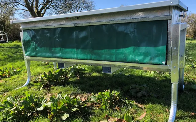 A stainless steel Condon Calf Controlled Feeder