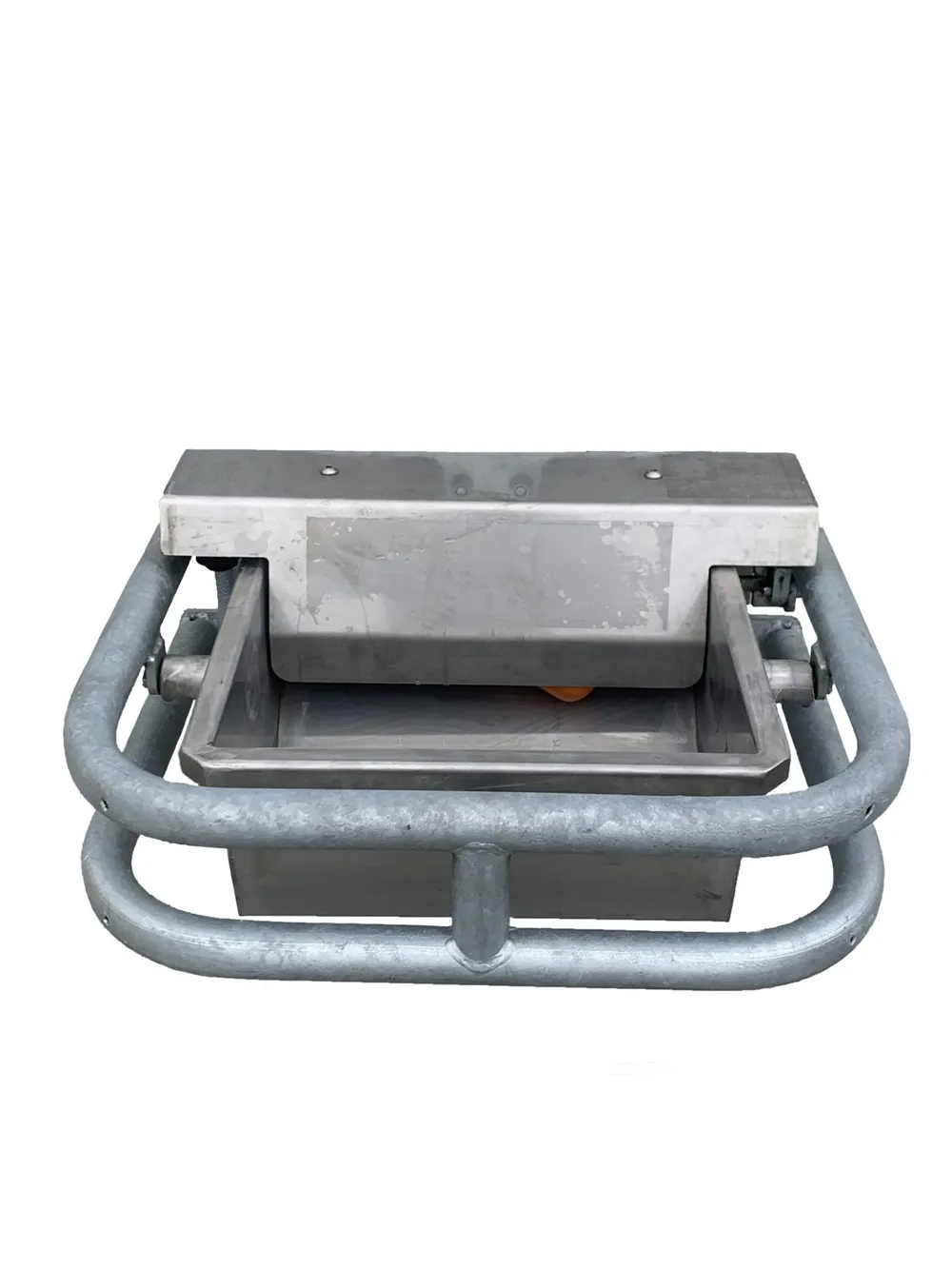 A stainless steel Condon tip-over drinker