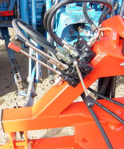 The three-lever hydraulic control bank mounted on the knocker's frame
