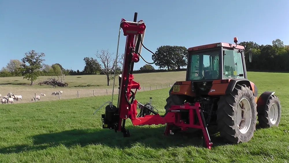 The P230S on the back of a tractor in a sheep field, mast raised
