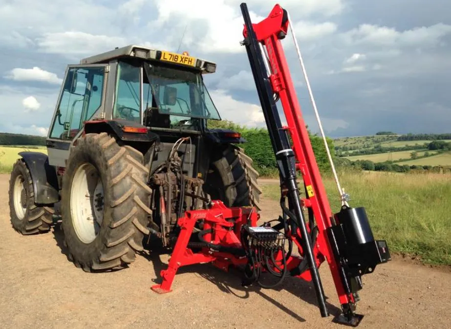 A Protech P230S hydraulic post knocker mounted on the rear of a tractor