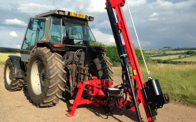 A Protech P230S hydraulic post knocker mounted on the rear of a tractor