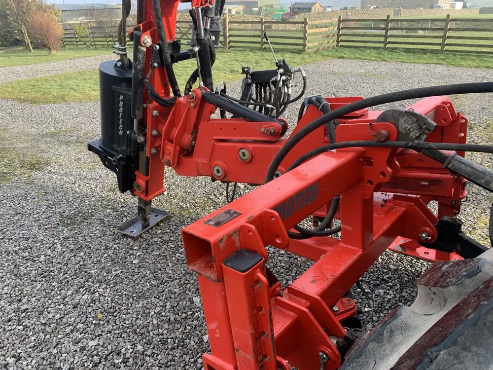 The P300S folded down on the linkage in a gravel yard