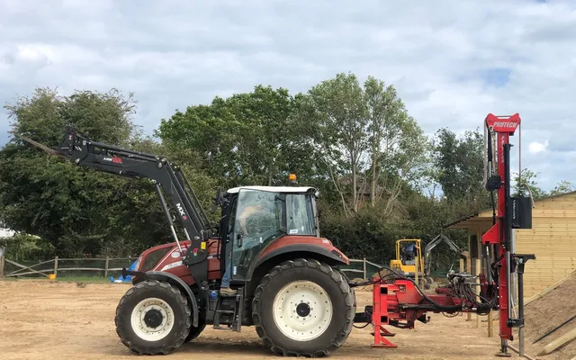 A Protech P300S hydraulic post knocker mounted on the rear of a tractor