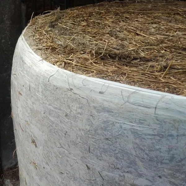A round bale wrapped in Silawrap net-replacement film instead of net